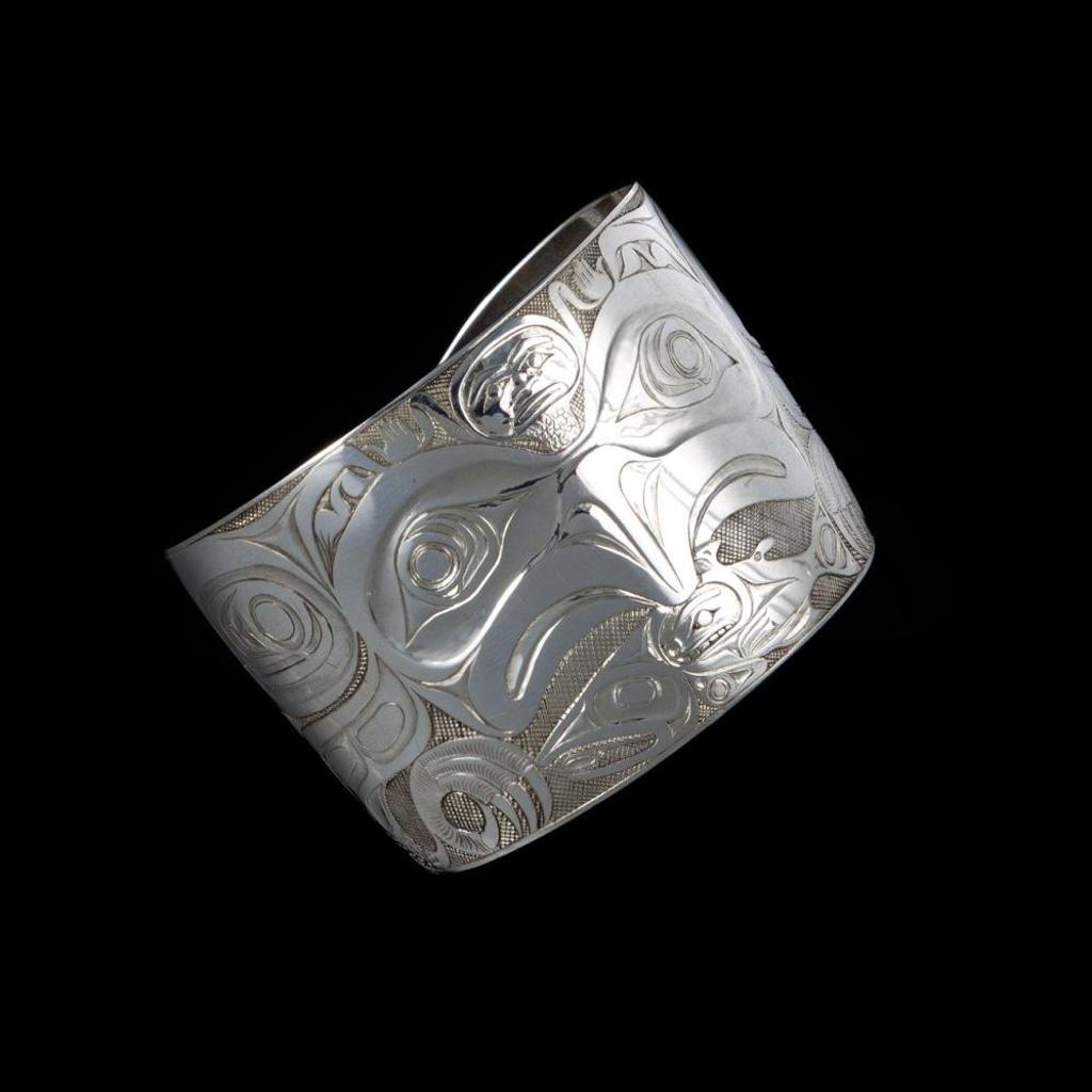 Bill (William) Ronald Reid (1920-1998) - a carved silver cuff bracelet depicting Haida Eagle