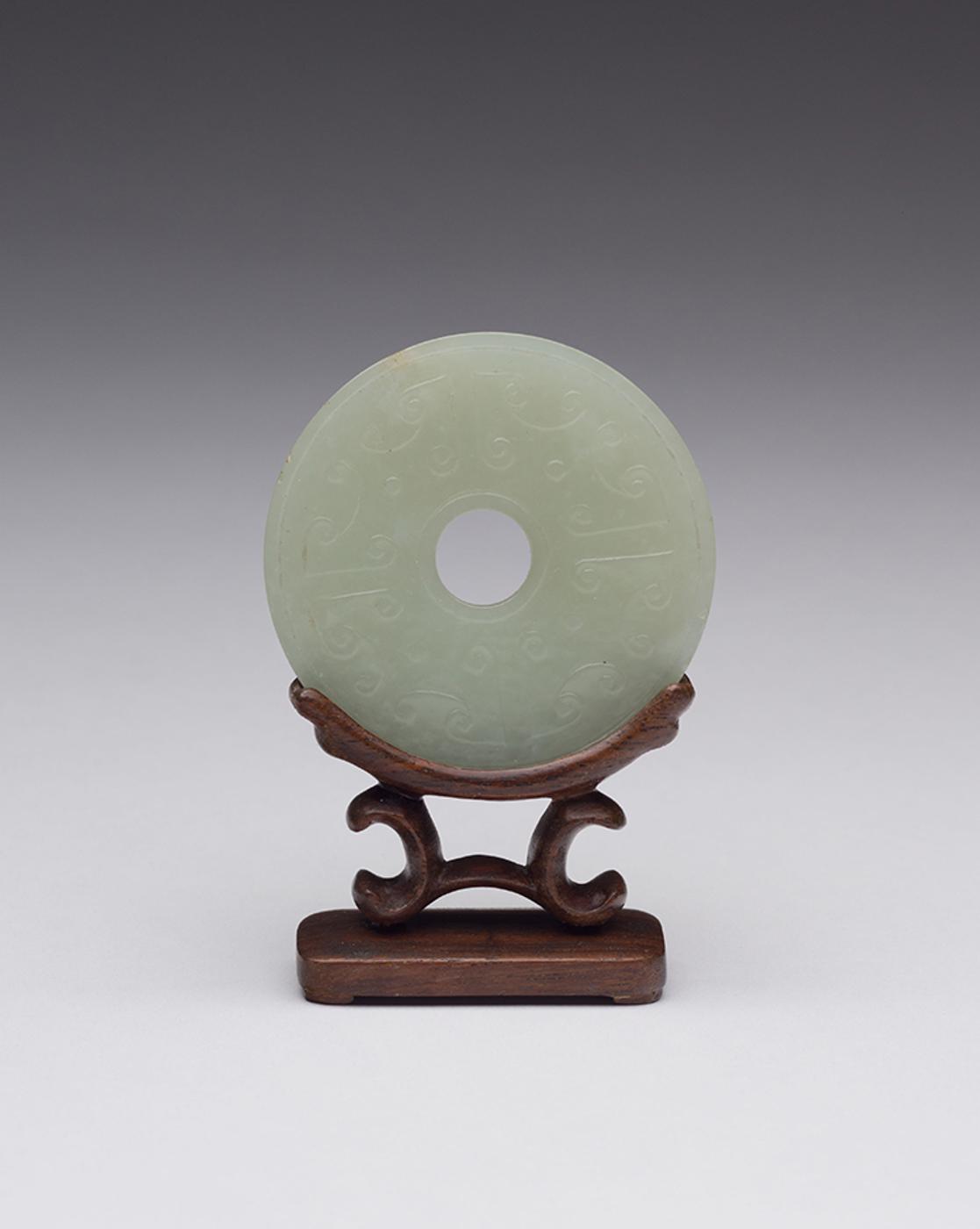 Chinese Art - A Chinese Pale Celadon Carved Bi Disc, 19th Century