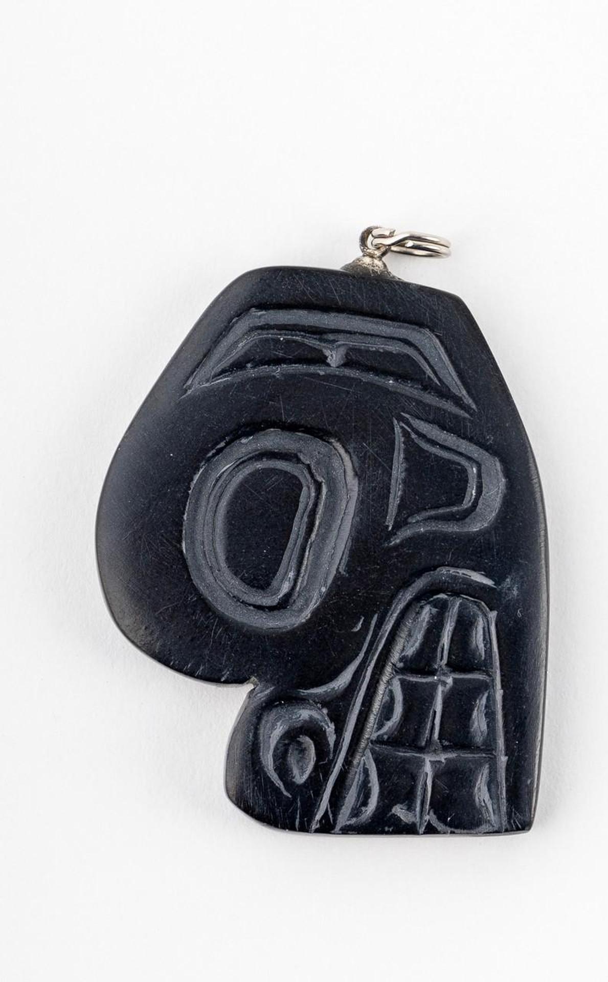 Gryn White - a carved argillite pendant depicting Bear