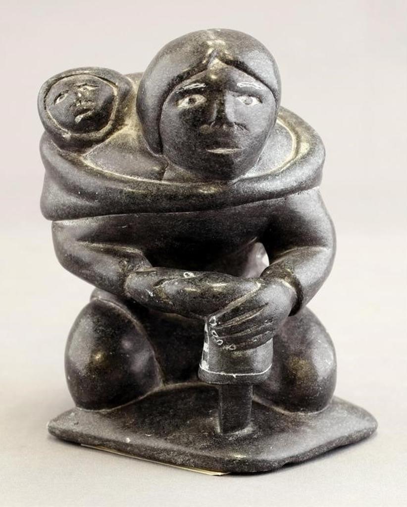 Adamie Alaku Anauta Anautak (1946-2016) - a dark grey stone carving of a Mother and Child