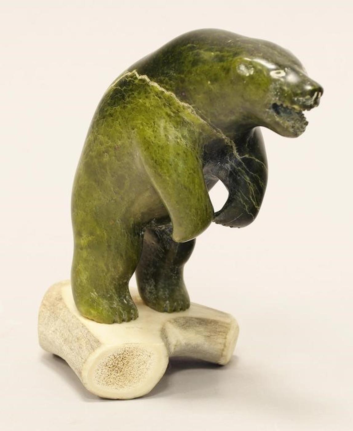 David Analok - A dark green stone carving of a Standing Bear on an antler base