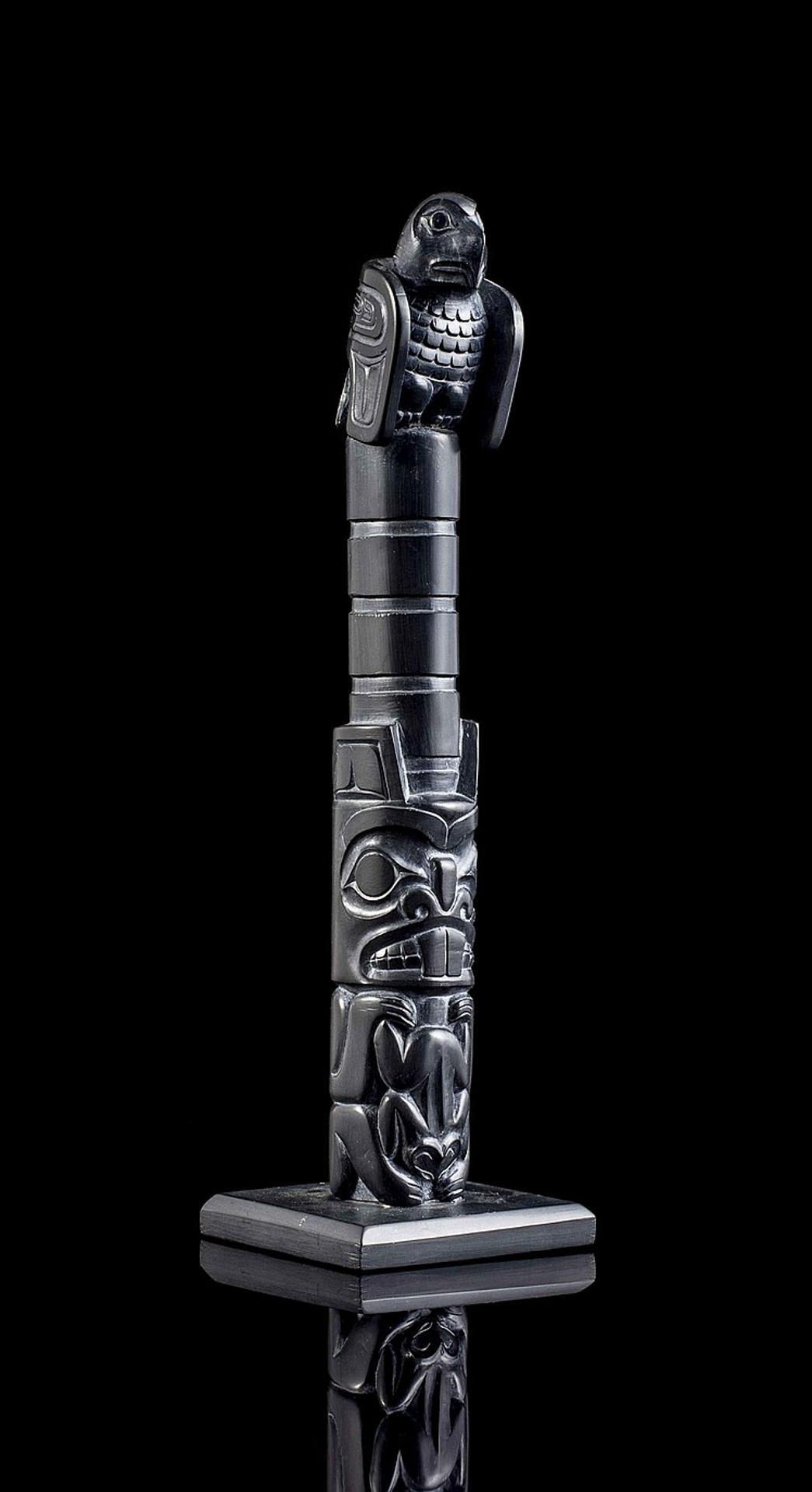 Brad Collinson - a carved argillite pole in the form of a house post