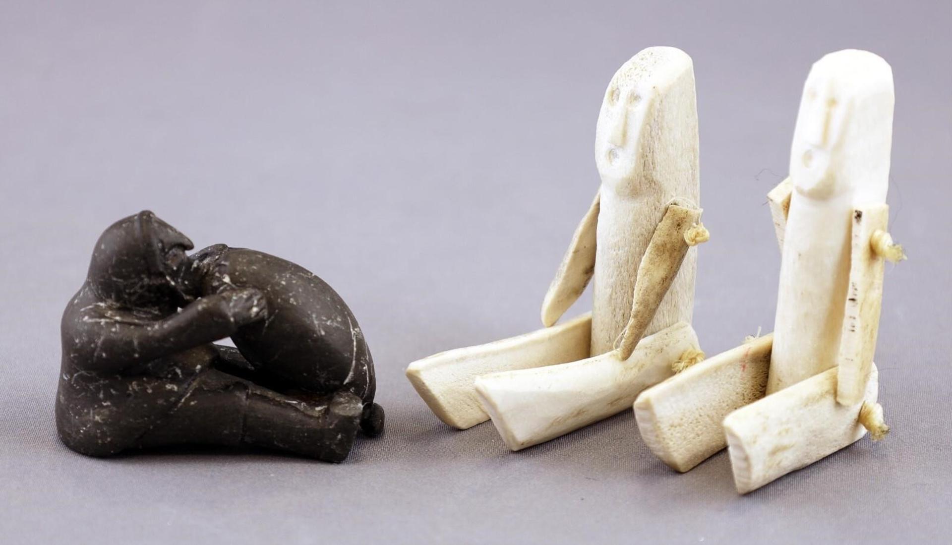 Miniature Inuit Carvings - two articulated bone dolls (heights 3.5 and 3 in.)