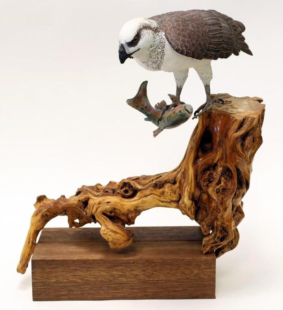 Deanna Bartholow - carved tupelo wood with acrylic, on a branch-form base, depicting an Osprey with Fish
