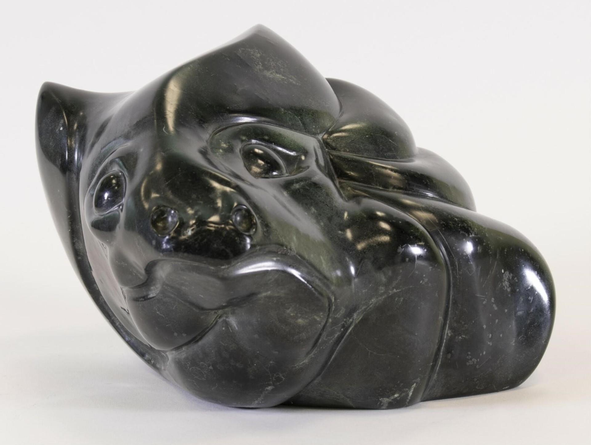 B. Nieswano - a serpentine carving of an Abstracted Wolf Head