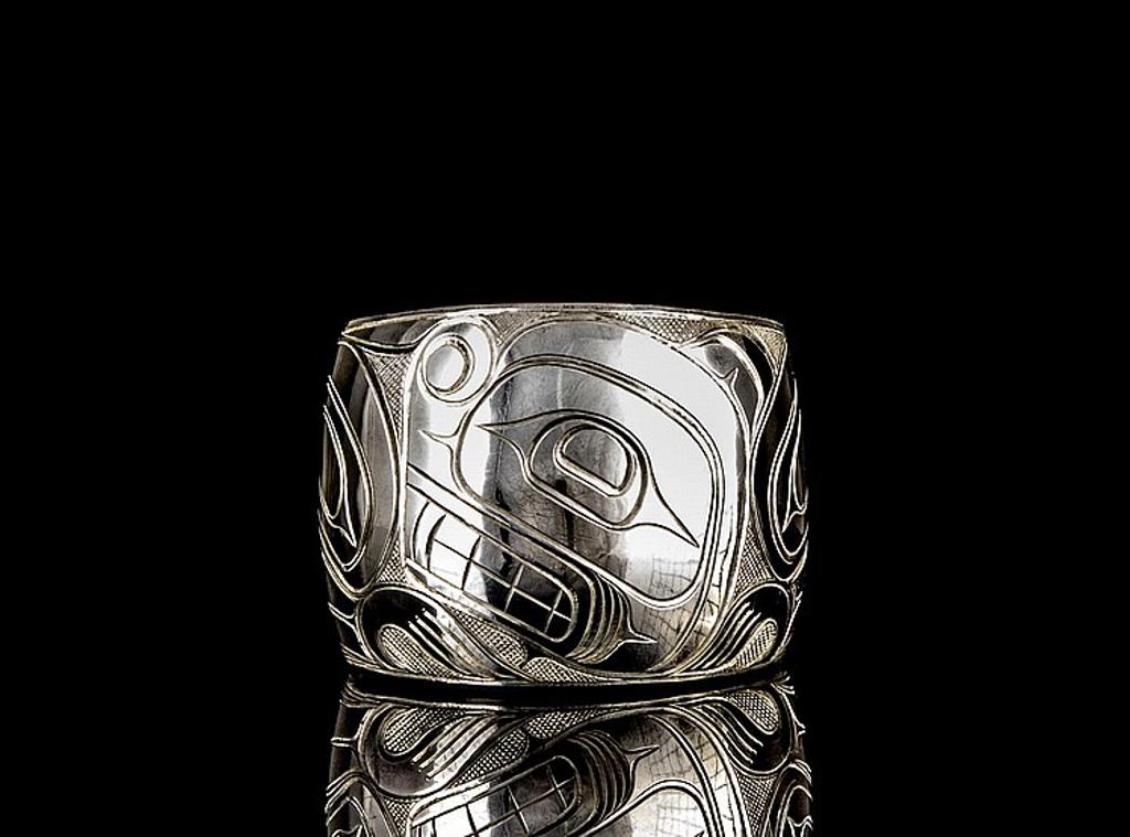 Lloyd Wadhams - a silver cuff bracelet decorated with Beaver design