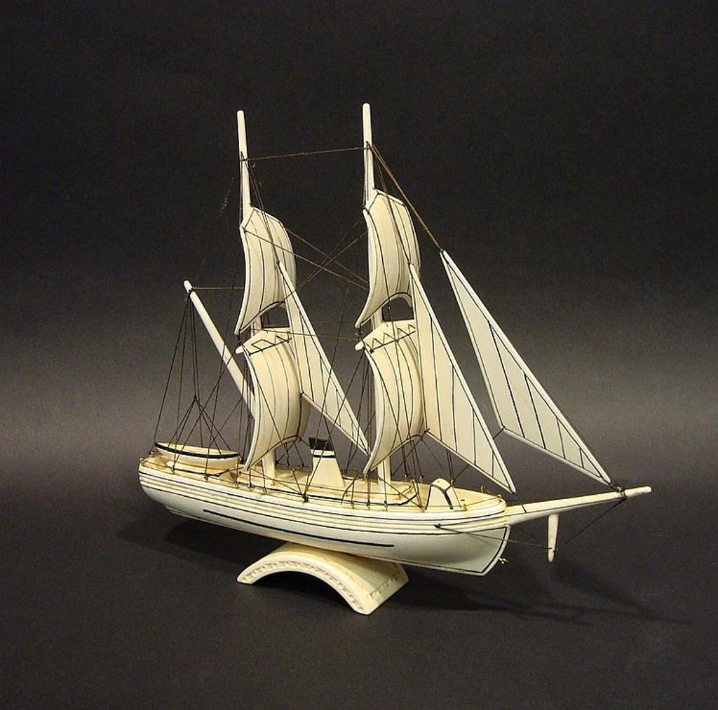 Carl O. Lyakitan - a carved walrus ivory twin masted sailing vessel