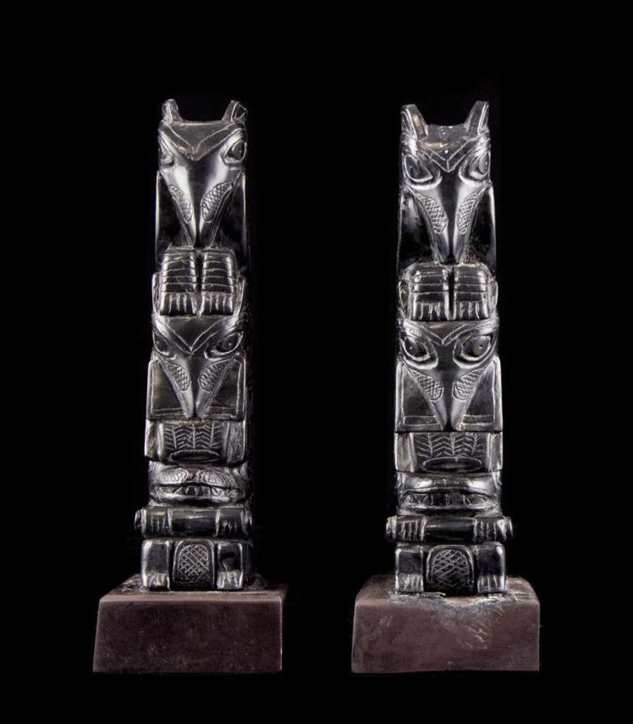 Moses Ingram - a pair of carved argillite candlesticks in the form of totem poles