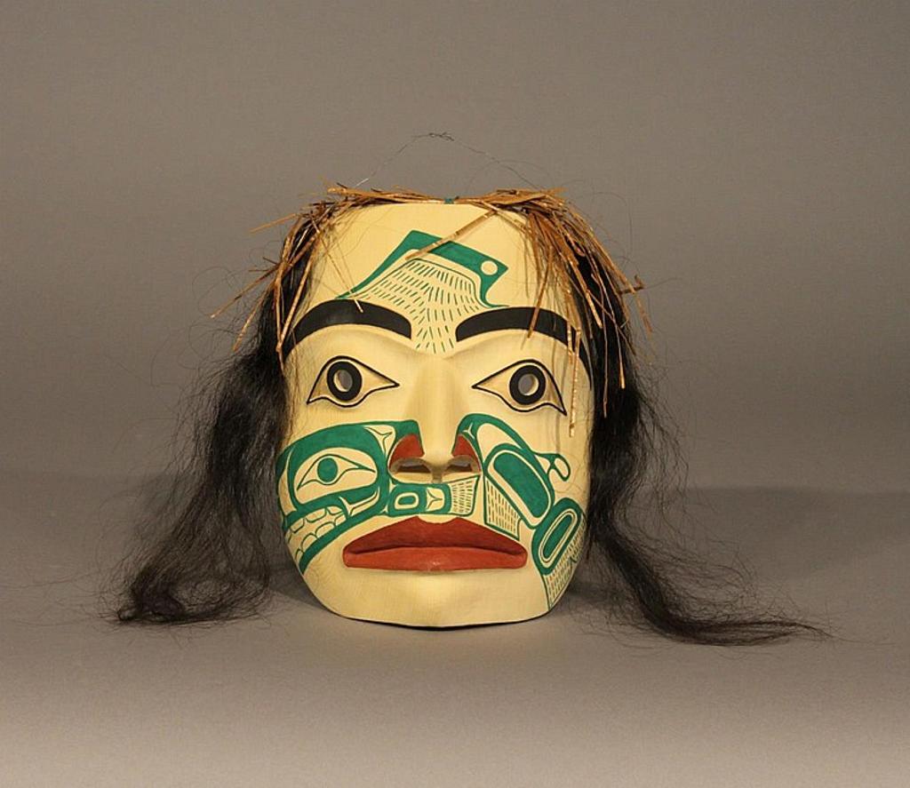 Henry Venn Robertson (1934-2016) - a carved and polychromed yellow cedar mask of Salmon Woman