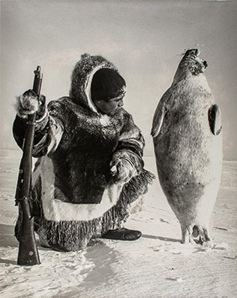 Richard Harrington (1911-2005) - Kalaut with seal he has shot near Igloolik, N.W.T., 1952