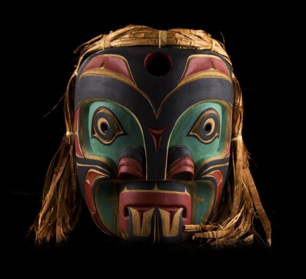 Richard Patterson - a carved and polychromed Pugwis mask with cedar strip hair