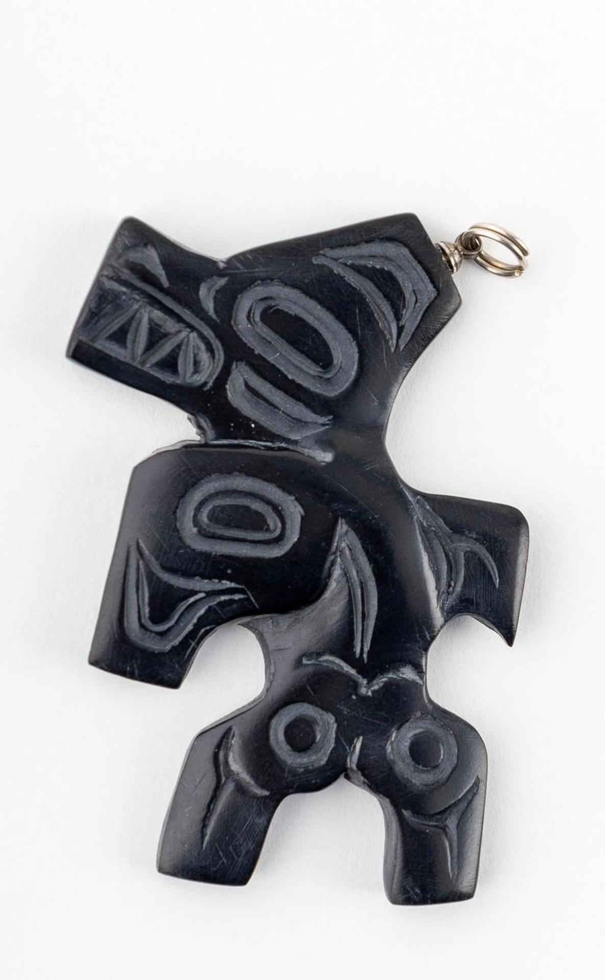 Gryn White - a carved argillite pendant depicting Killer Whale