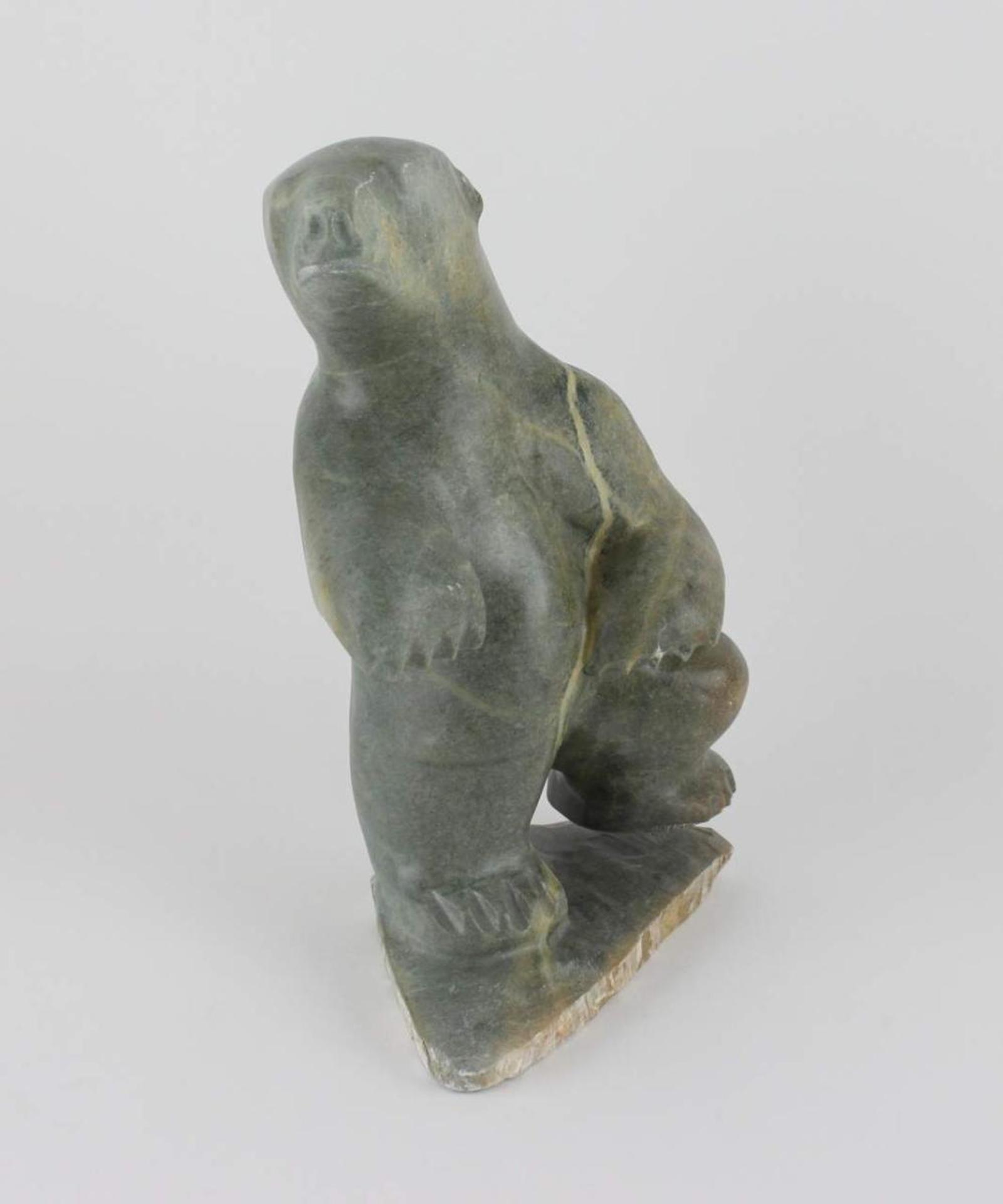 Antoine - a large green stone carving of a standing bear