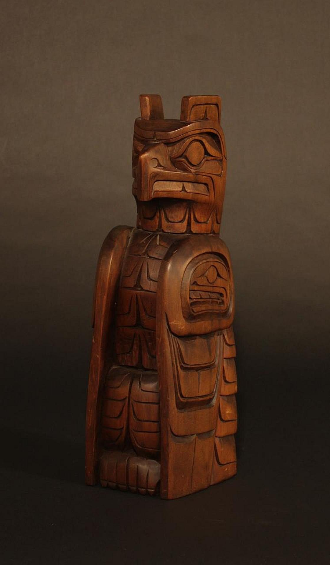 Eric Baker (1961) - a carved and stained red cedar Raven pole