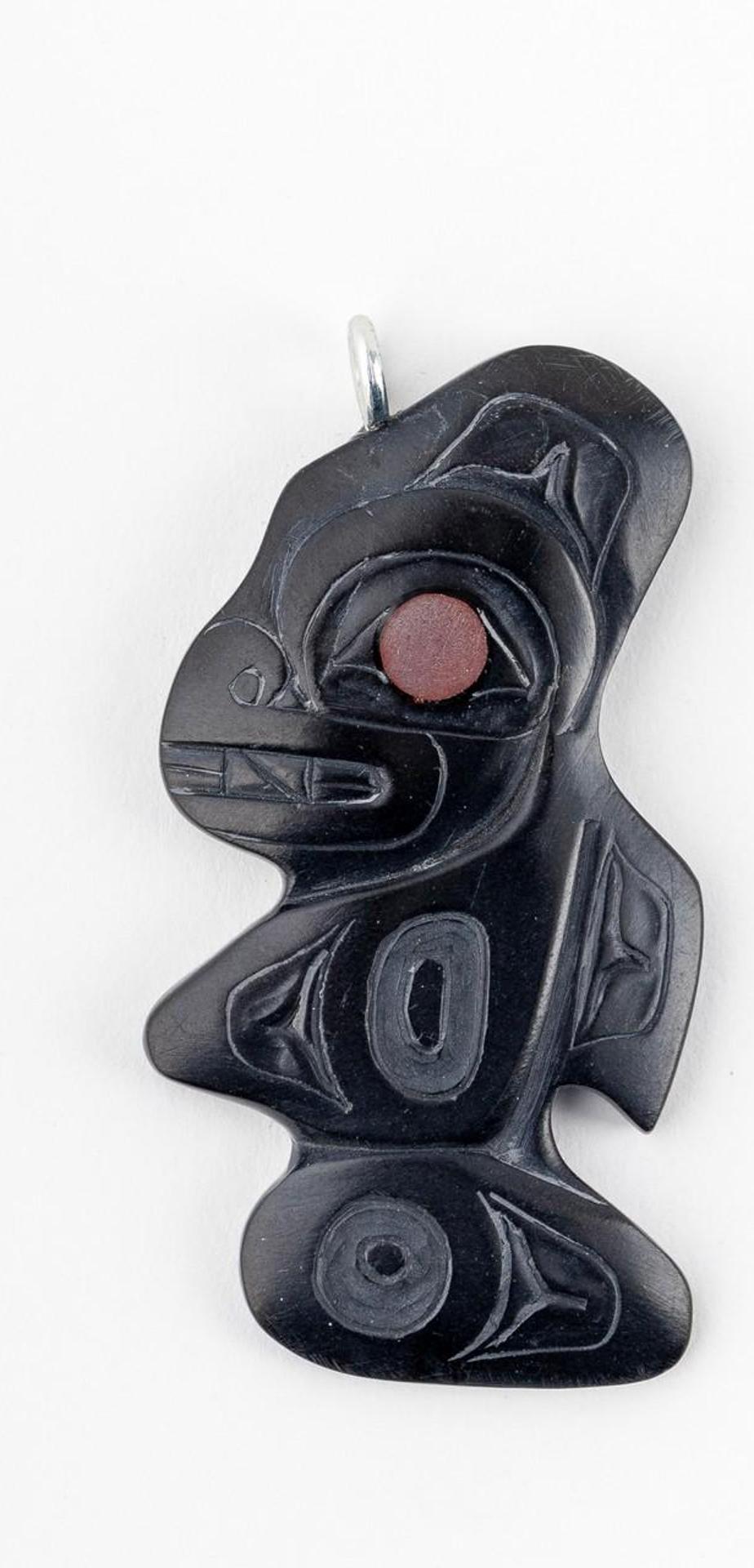 Gryn White - a carved argillite pendant depicting Killer Whale