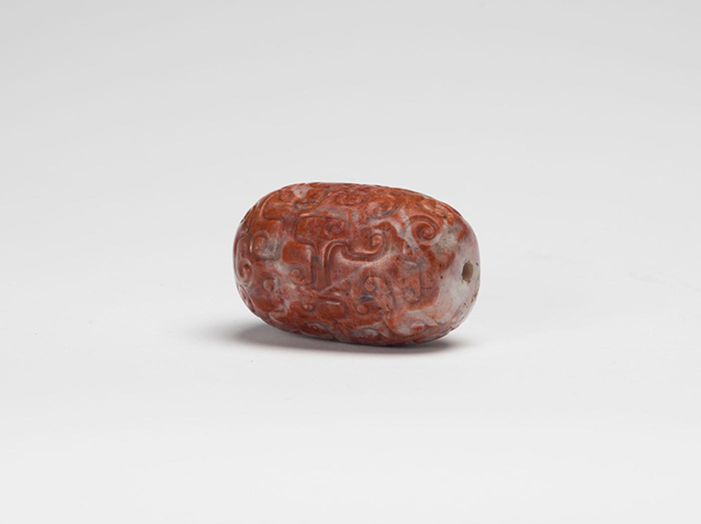 Chinese Art - A Large Chinese Mottled Russet Carved Archaistic Bead, Qing Dynasty