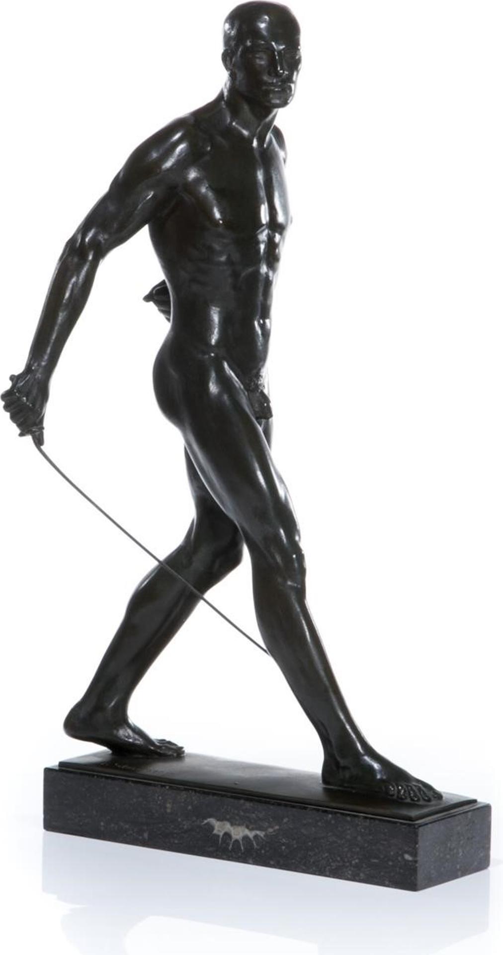 Reinhard Schnauder (1856-1923) - Late 19th / early 20th C. A bronze sculpture of a male nude figure in stride