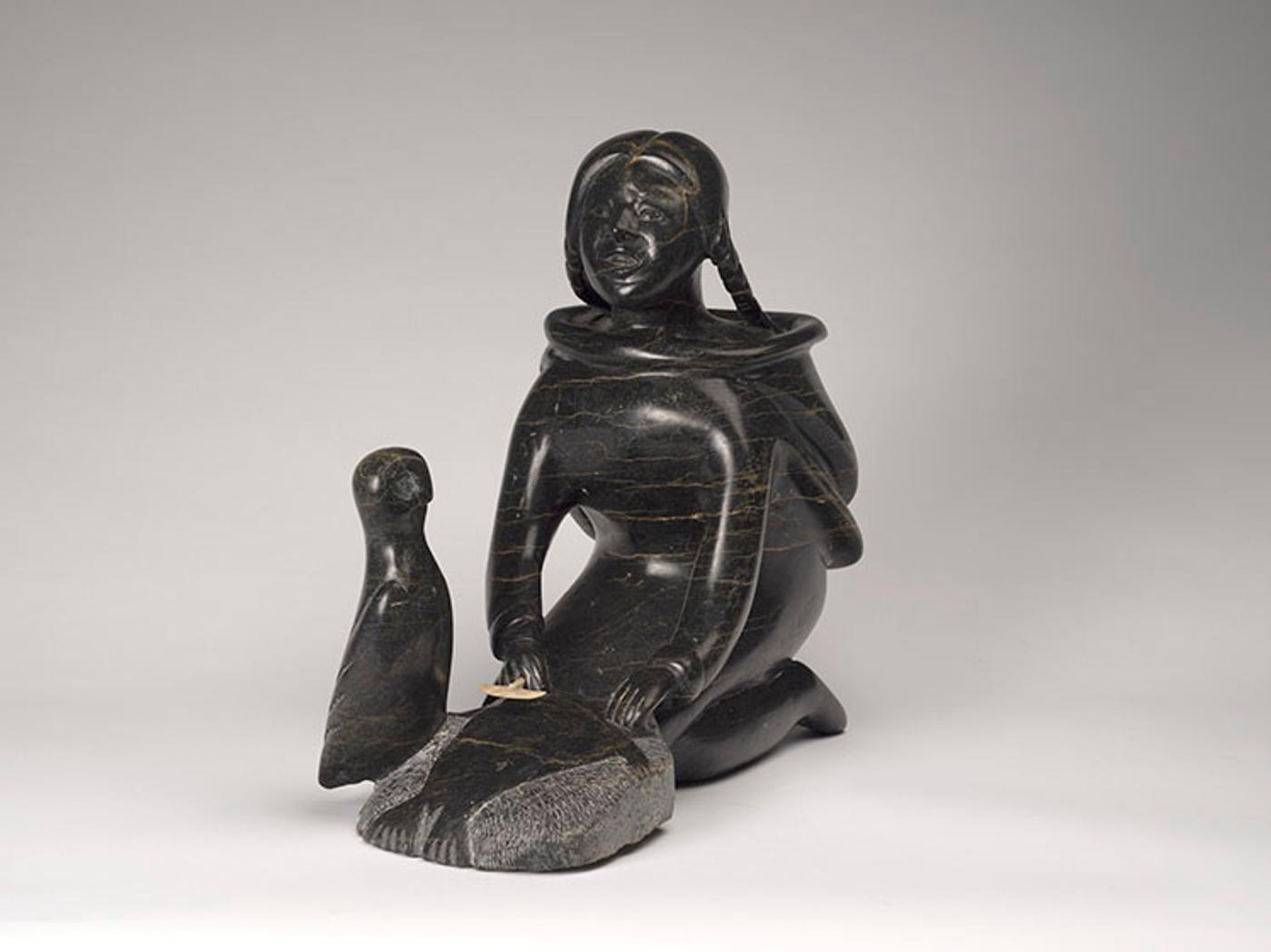 Osuitok Ipeelee (1923-2005) - Young Woman Preparing a Pelt with Owl Guide