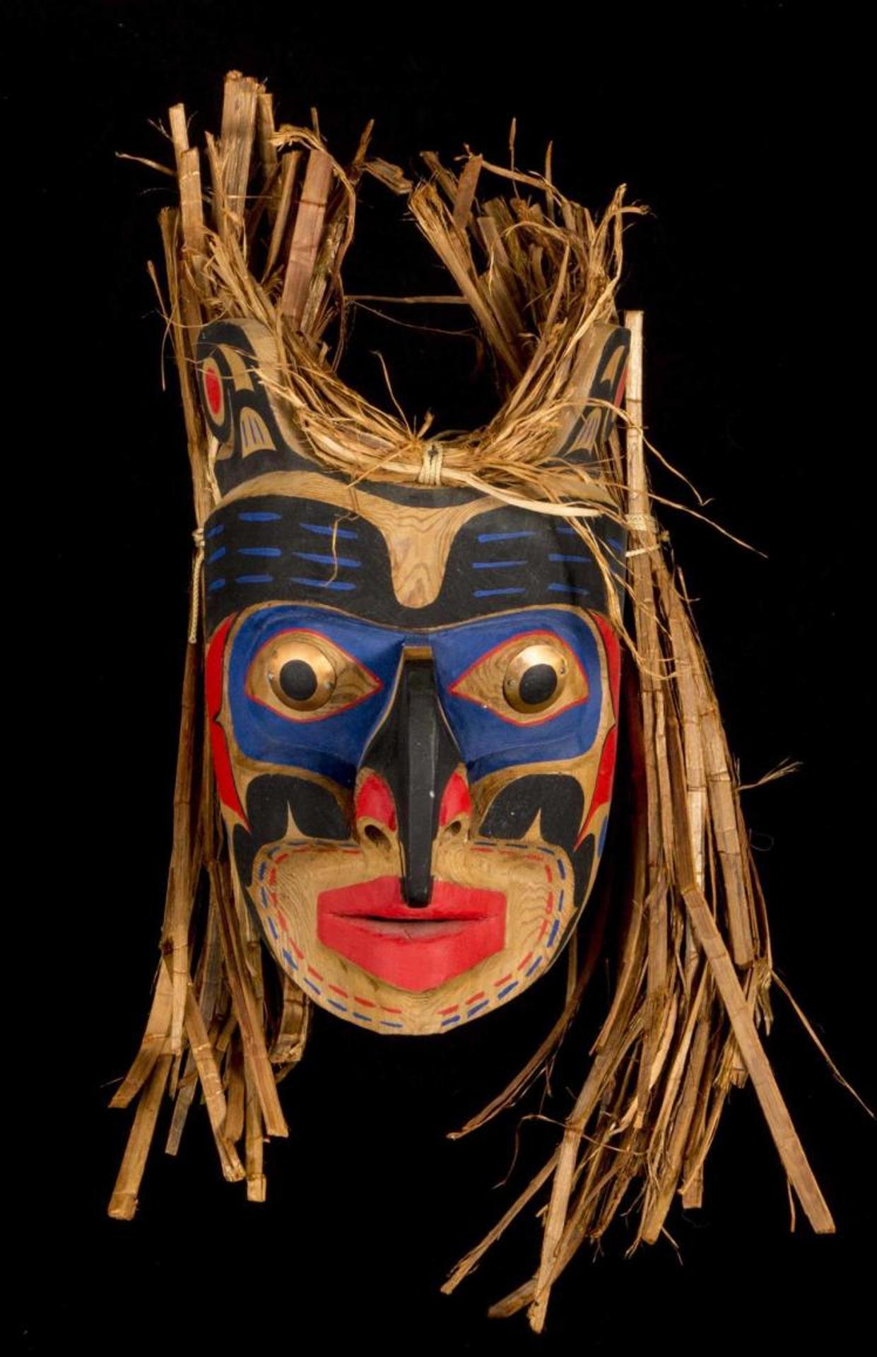 Tony Gulbrandsen - a carved and polychromed Hawk Man mask with cedar strip hair and copper eyes