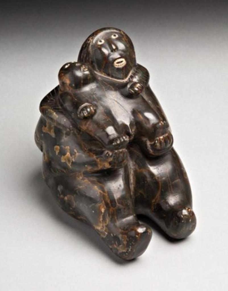 Johnny Inukpuk Jr. (1911-2007) - Marbled dark grey-brown stone, ivory and inlay