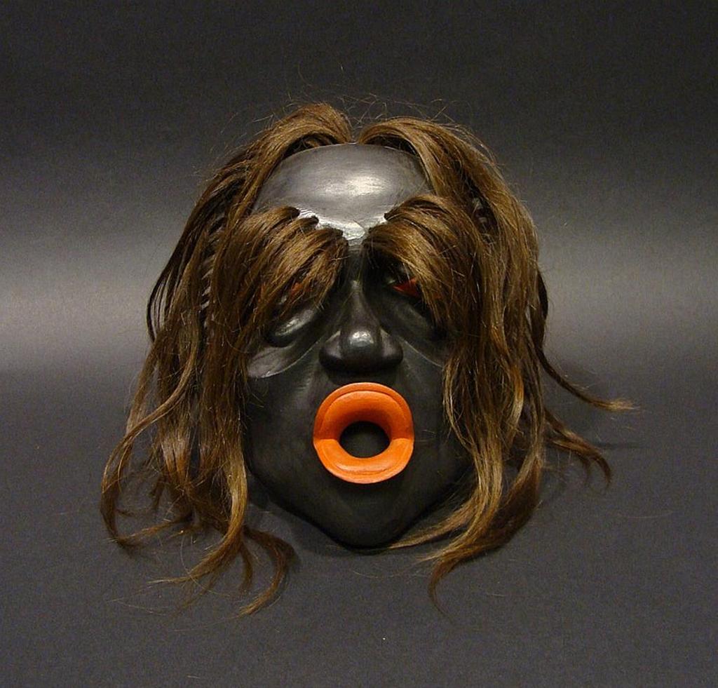 Beau Dick (1955-2017) - a carved and polychromed Tsonokwa mask signed and dated