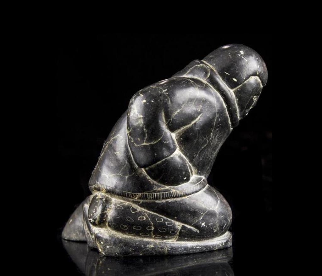 Panlosic Kan - a black soapstone carving of an Inuk