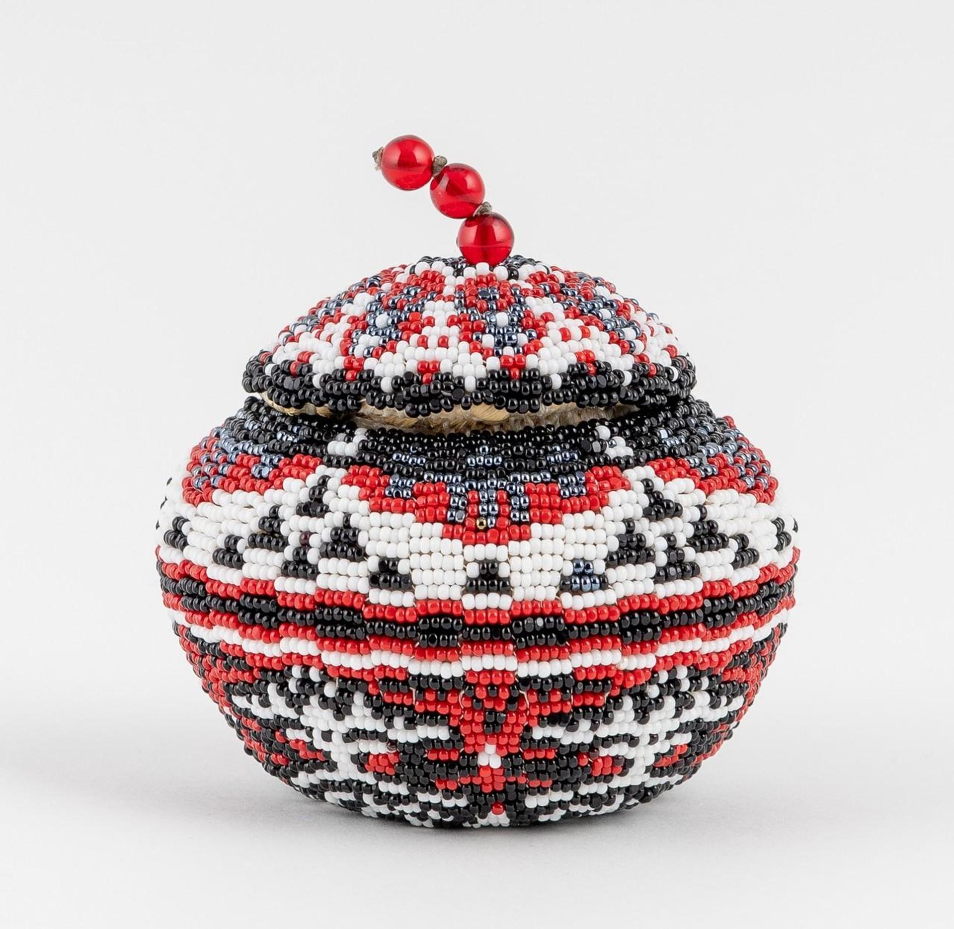 Cheryl Williams - a finely beaded lidded basket with red