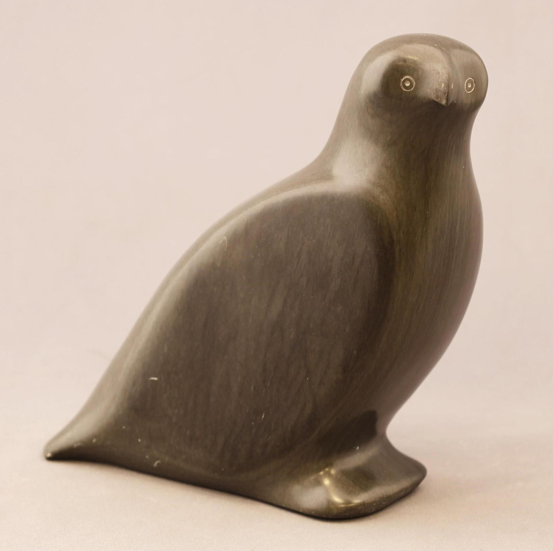 Annie Ippak (1947) - a grey stone carving of a Bird