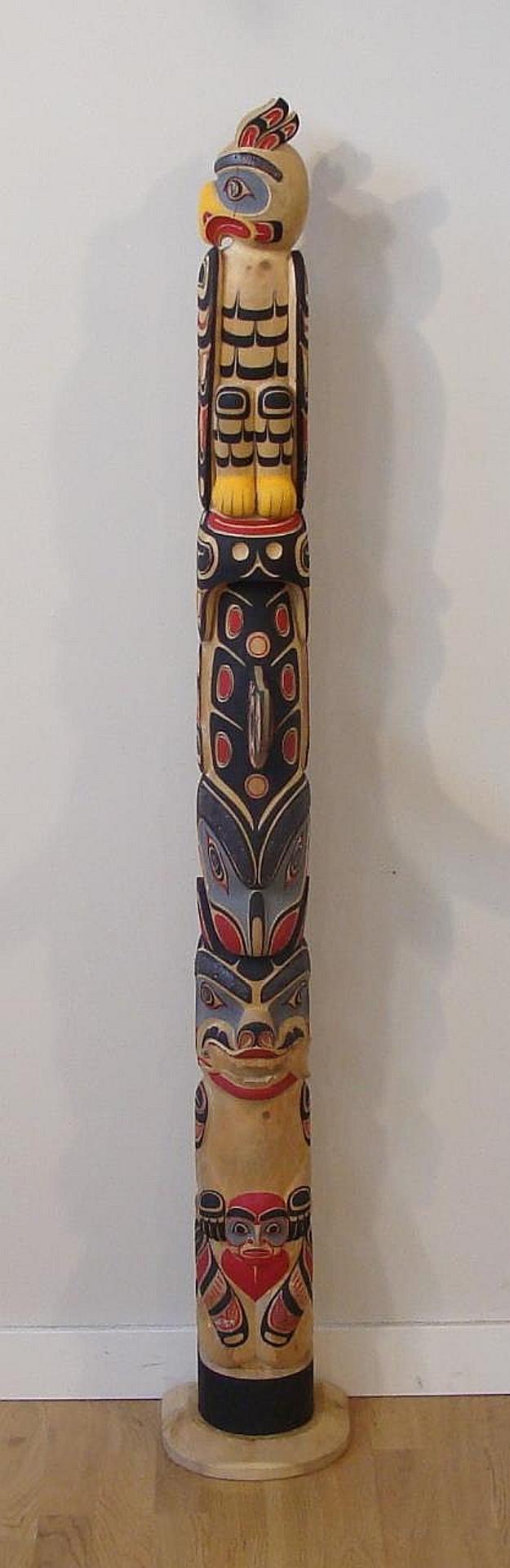 Paul Johnny (1932) - a carved and polychromed yellow cedar totem pole depicting Raven