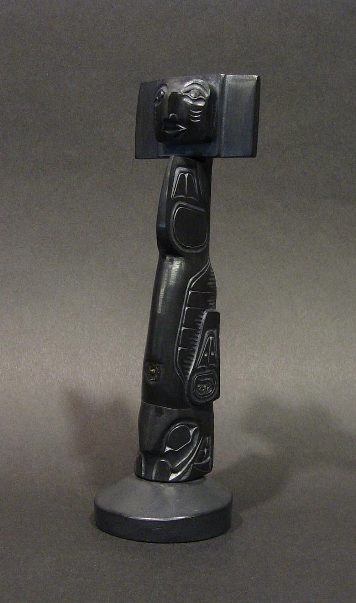 Glen Pollard (1957) - a carved argillite model pole in the form of a house post