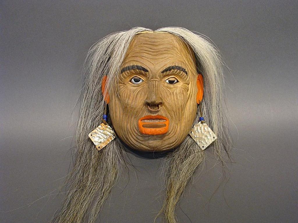 Corey Bulpitt (1978) - a carved and polychromed Noni mask