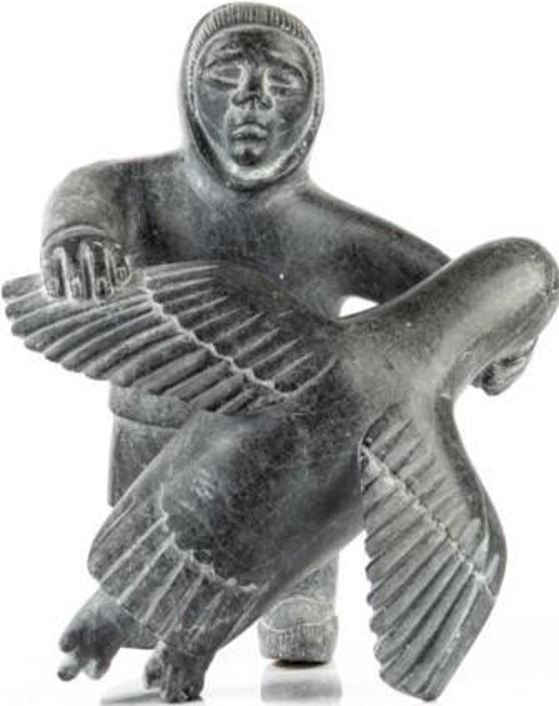 Prime Okalik (1923-2000) - Standing Inuit male holding large bird