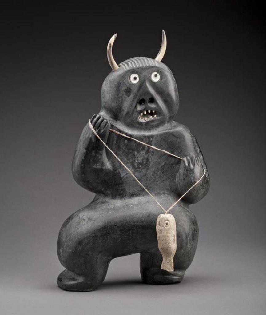 Judas Ullulaq (1937-1998) - Shaman with Fish and Spirit Face, c. 1995, stone, whale bone, muskox horn
