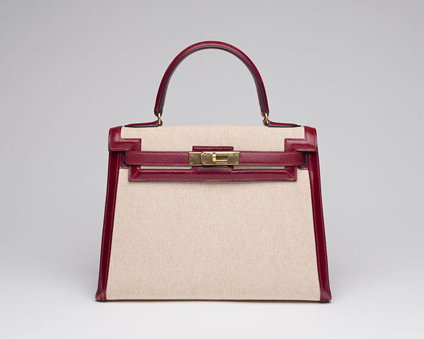 Hermès - A VINTAGE TOILE AND ROUGE H BOX KELLY 28 SELLIER GOLD HARDWARE