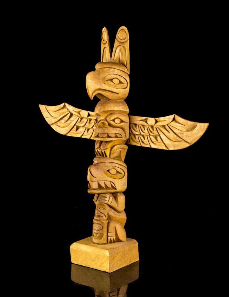 Wilson A. Williams - a carved cedar totem pole with outstretched wings