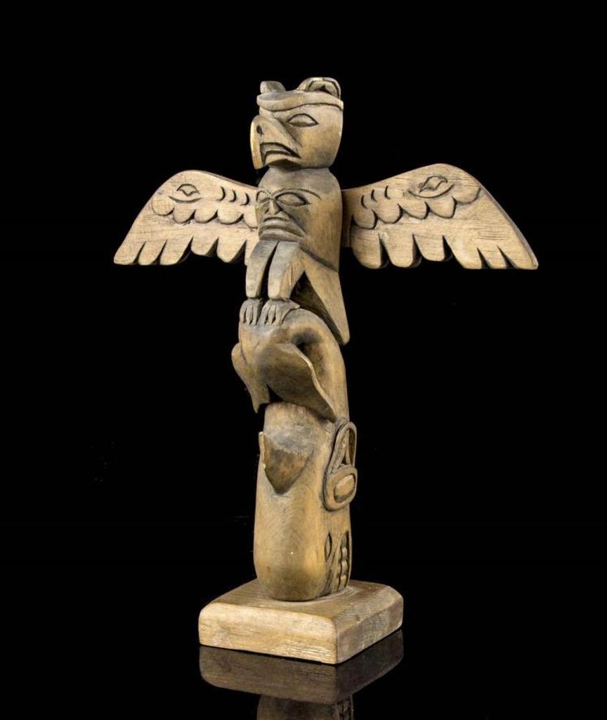 Cicero August (1940) - a carved and stained two figure totem pole depicting Thunderbird and Killer Whale