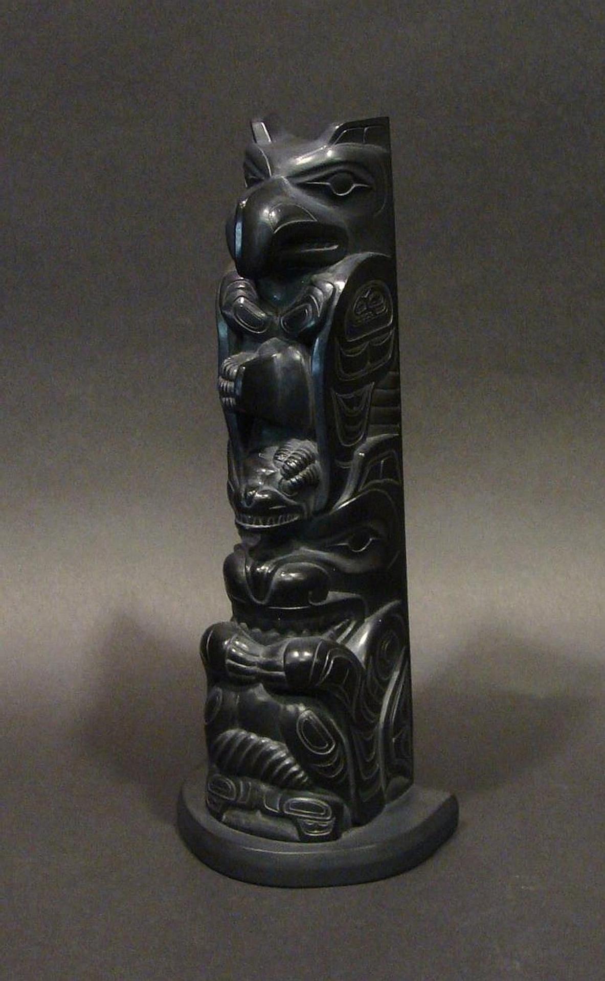 Garner Moody (2006) - a carved argillite model pole depicting Raven atop Bear
