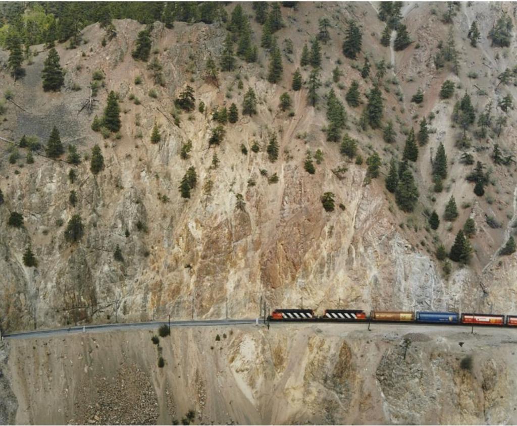 Edward Burtynsky (1955) - Railcuts #8 (Red Hill, C.N. Train) C.N. Track, Thompson River, British Columbia, 1985