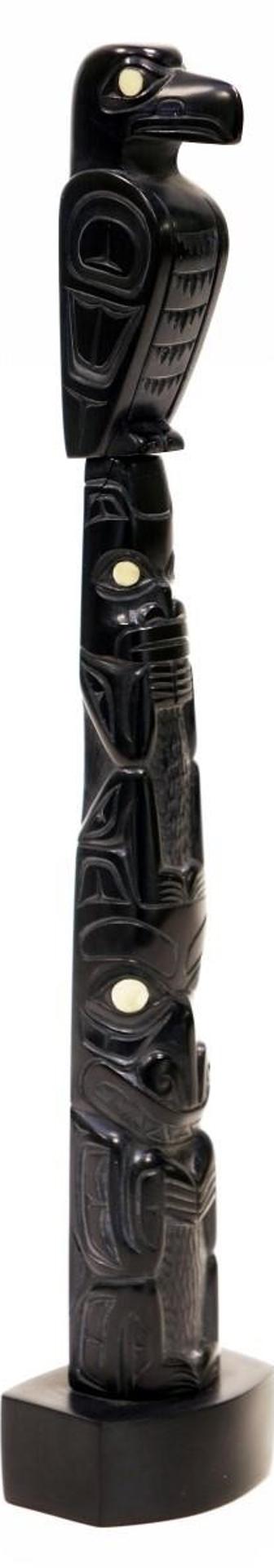 Glen Pollard (1957) - a multi-figural carved argillite Totem, with abalone inlays, depicting an Eagle and Two Bears