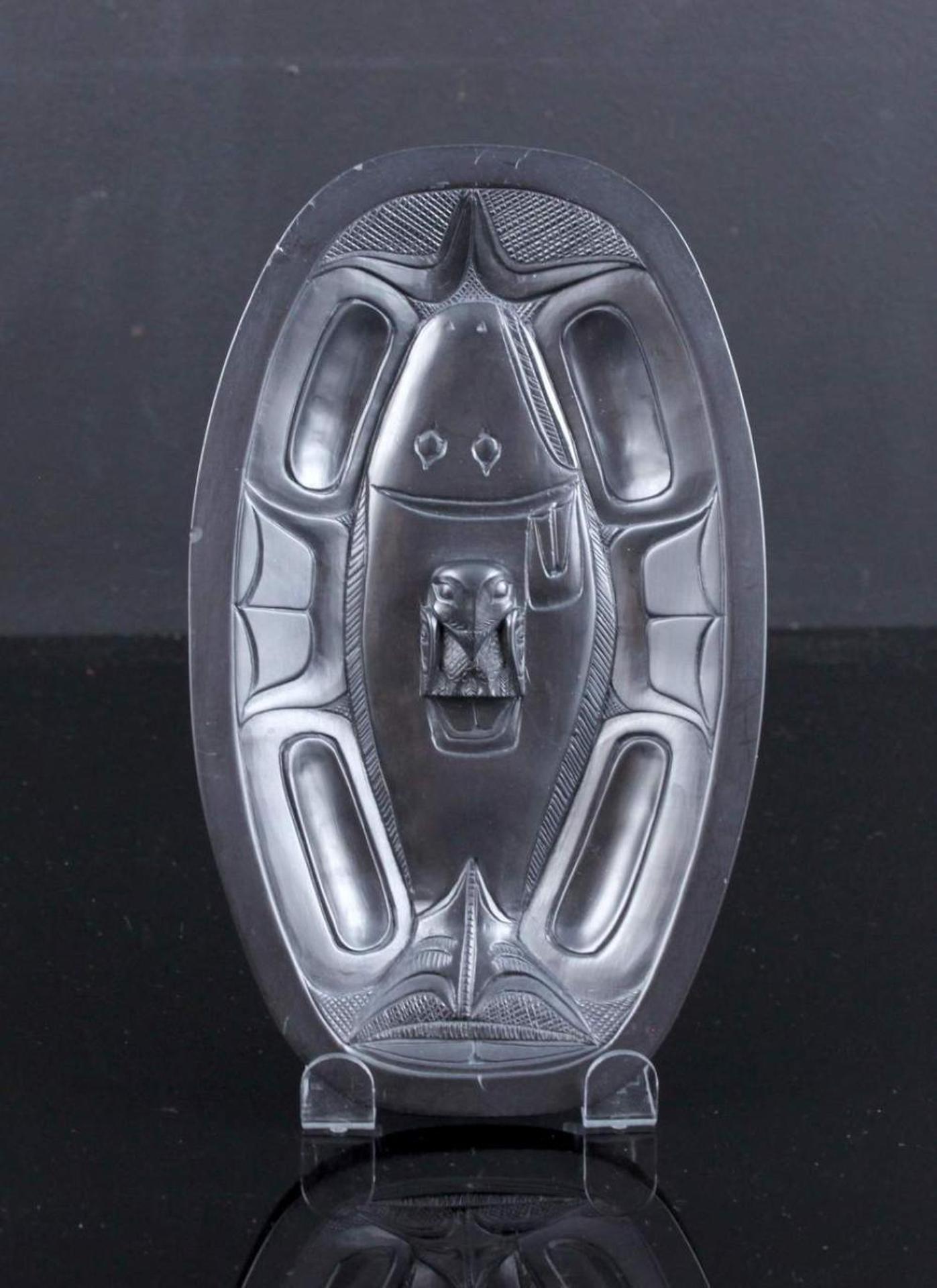 Rufus Moody (1923-1998) - an oval carved argillite dish decorated with an image of Halibut and Eagle