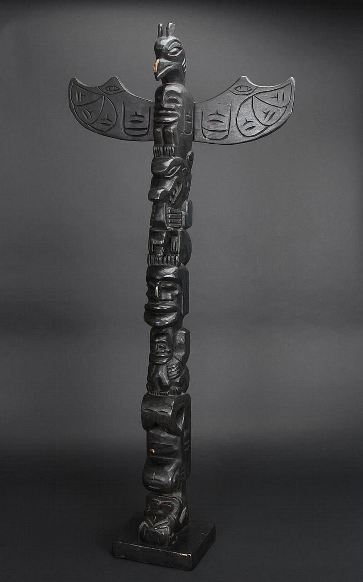 Alex Julian - a carved and ebonzied totem pole