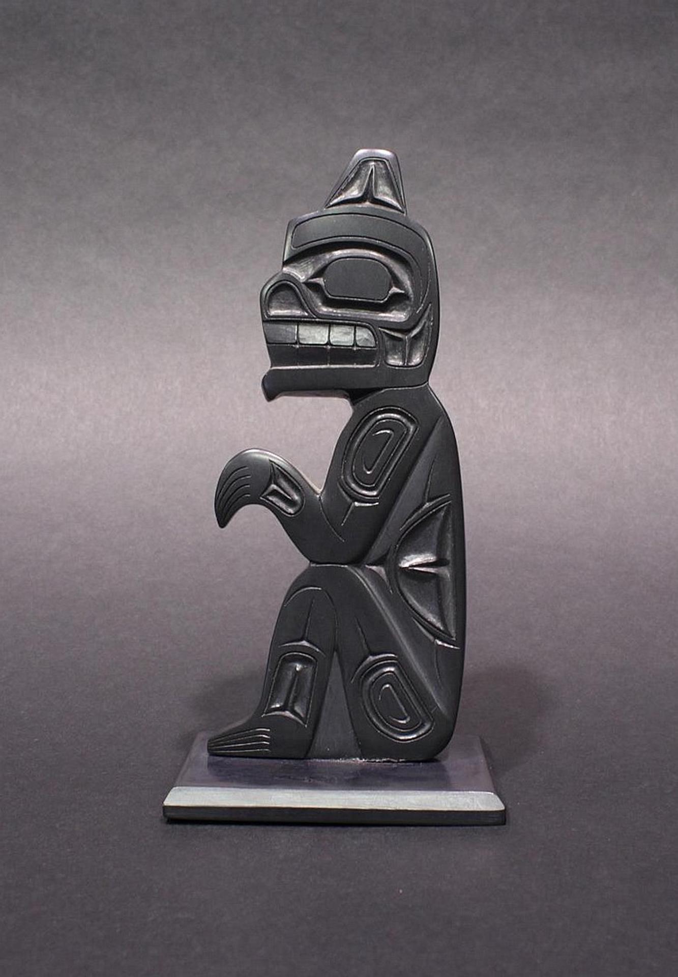 Francis Pollard - a carved argillite pole depicting Haida Bear