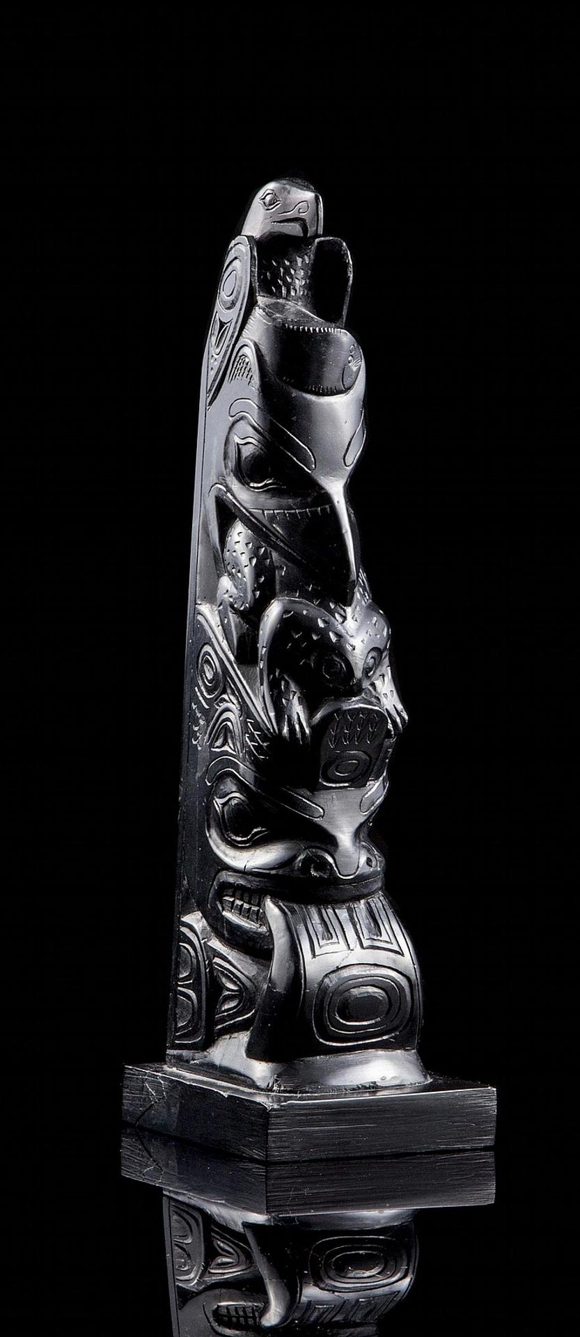 Claude Davidson (1924-1991) - a carved argillite totem pole depicting Eagle