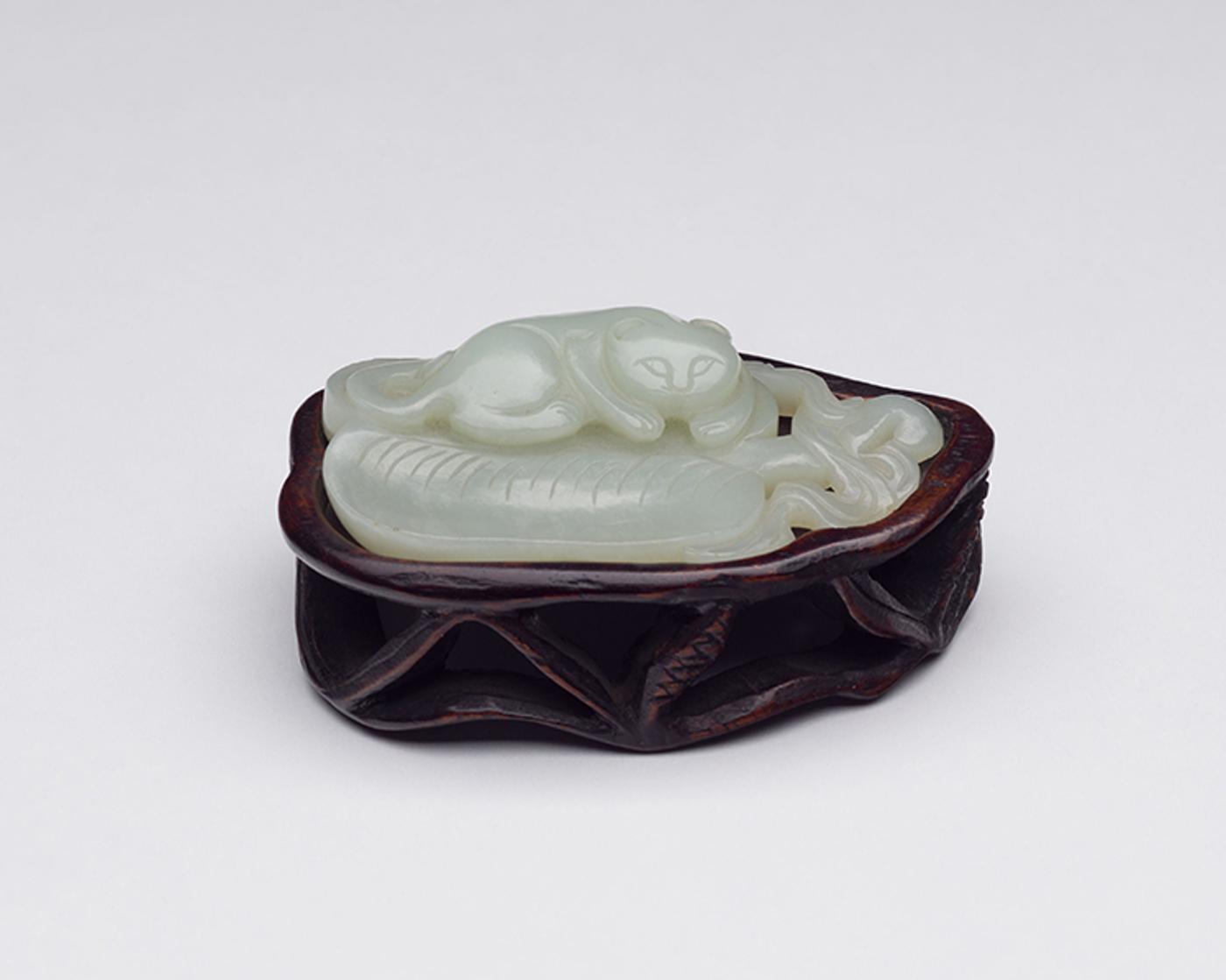 Chinese Artist - A Chinese Pale Celadon Jade Model of a Cat, Qing Dynasty