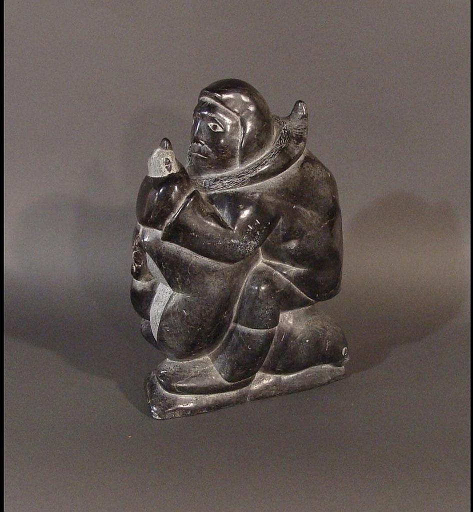 Adamie Alaku Anauta Anautak (1946-2016) - Akulivik a soapstone carving of a hunter holding a bird