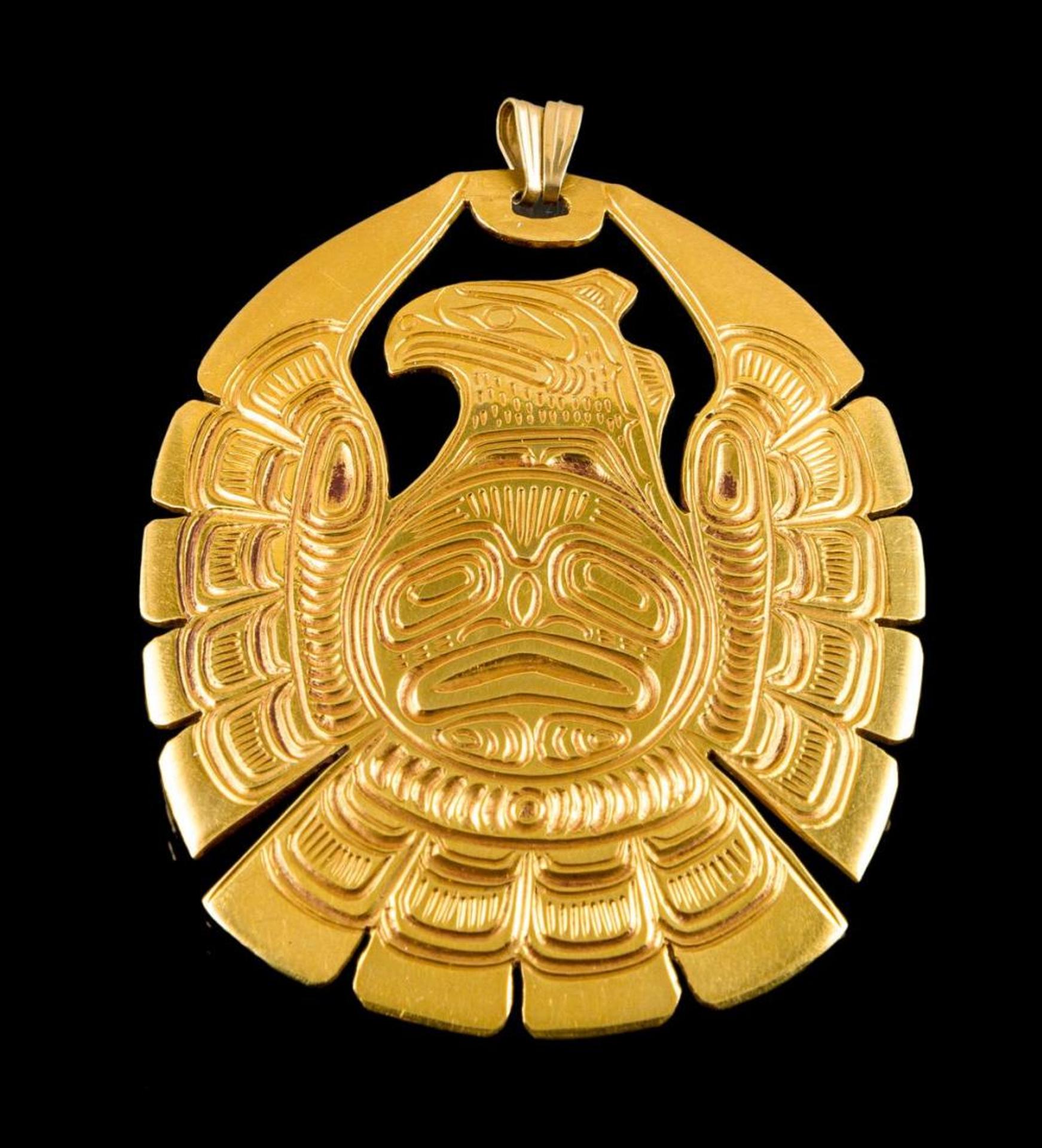 Lloyd Wadhams - a 24kt yellow gold pendant depicting Raven and the Sun