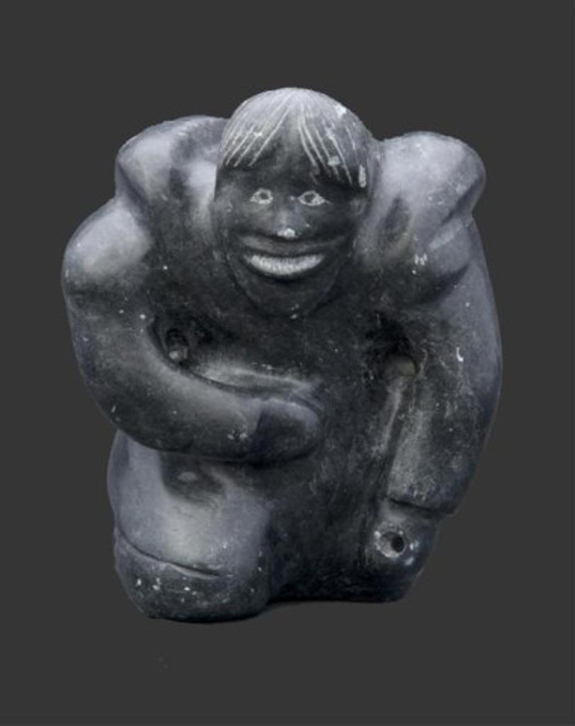 Jacob Irkok (1937-2009) - A dark stone carving of a kneeling hunter