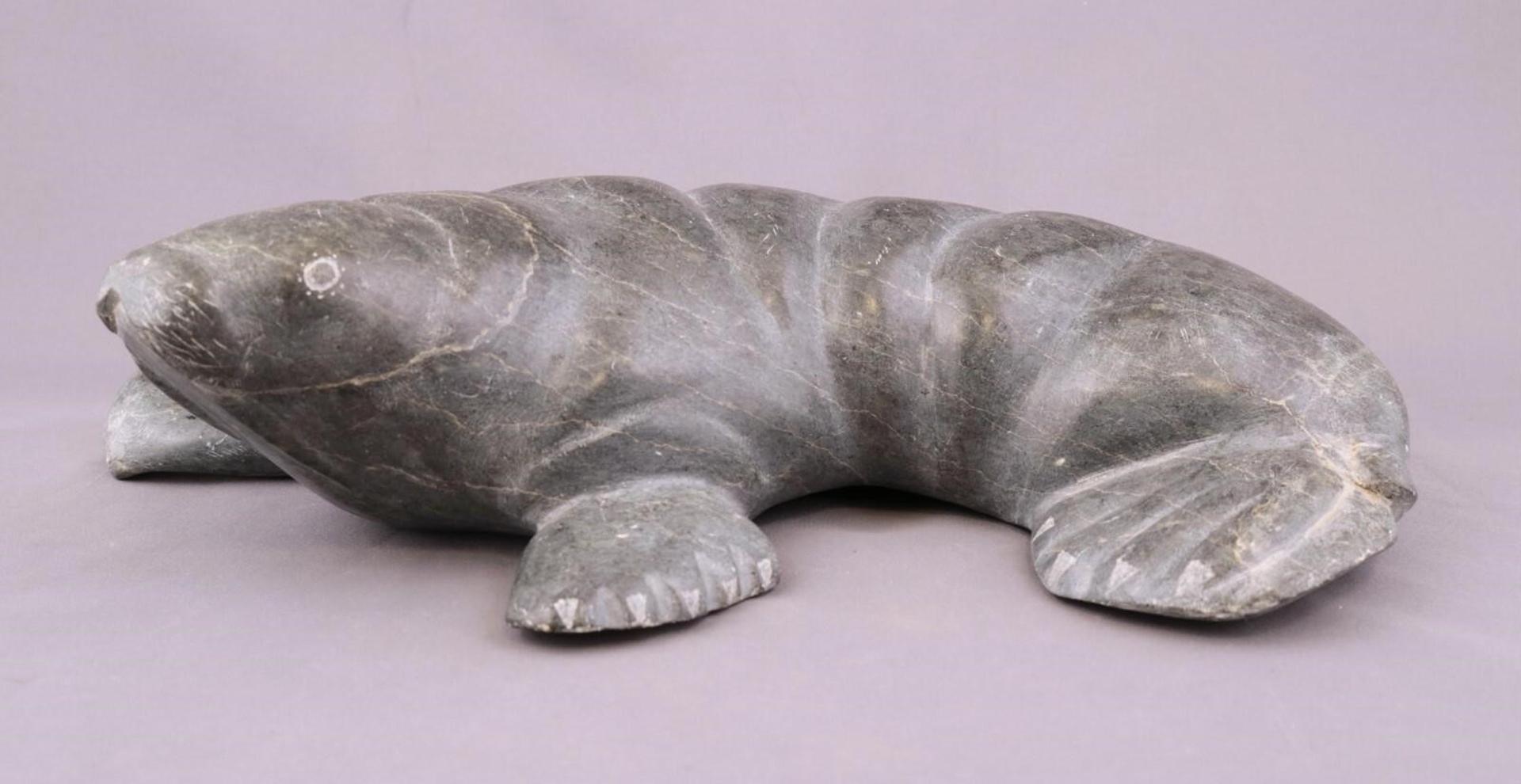 George Nunga (1950) - a grey marbled stone carving of a Walrus