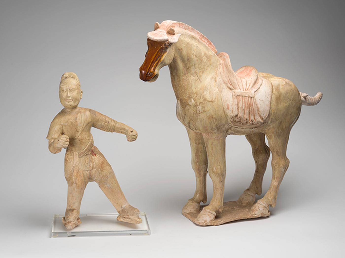 Chinese Art - A Chinese Straw Glazed Earthenware Figure of a Groom and Horse, Tang Dynasty (618-907 CE)