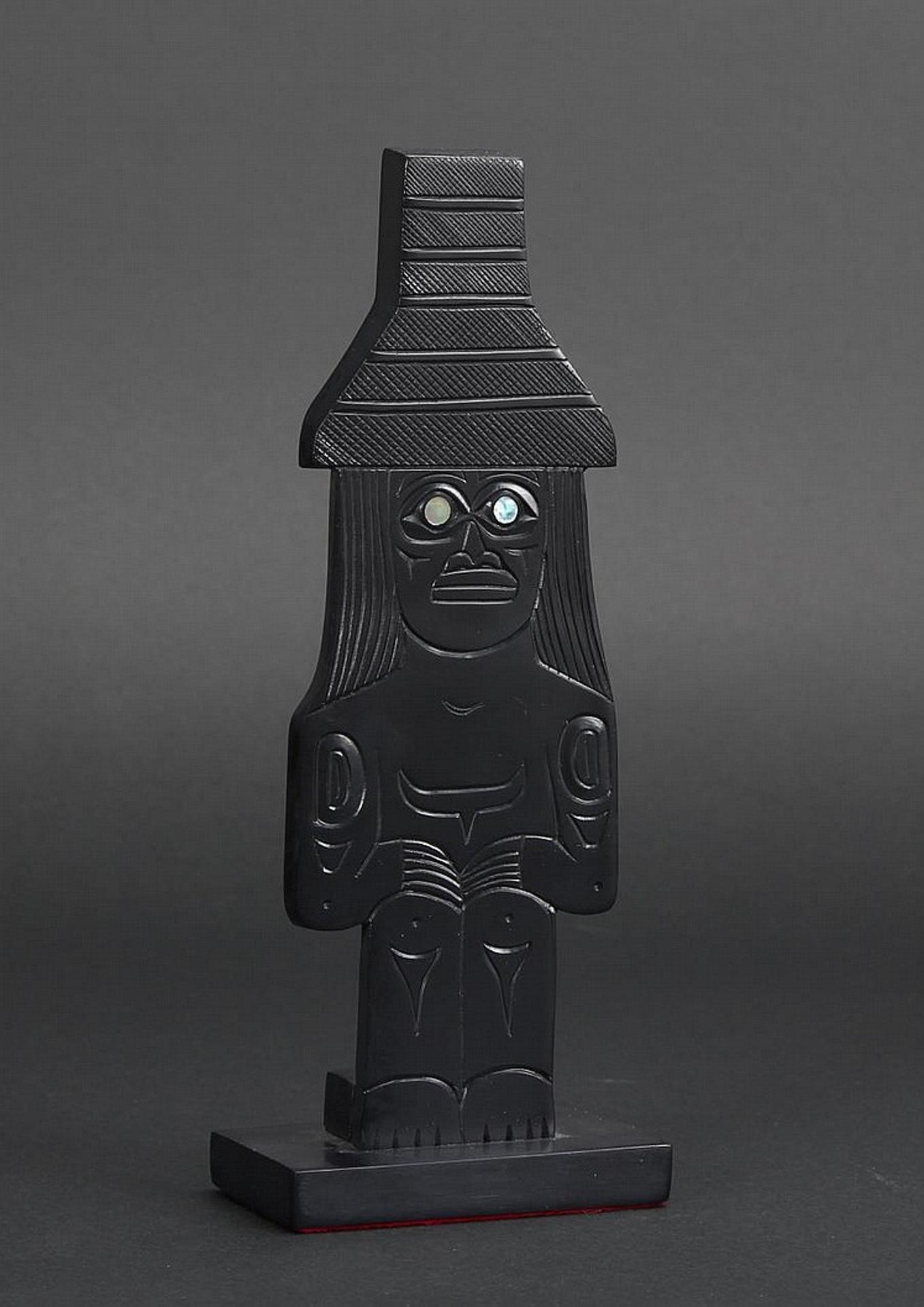 Shirley Longboat Pollard - a carved argillite panel in the form of a Haida Watchman